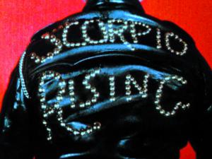 Still image from a film by Kenneth Anger entitled "Fireworks," depicting a leather jacket with the words "scorpio rising"